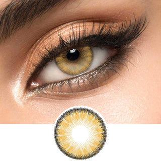 Close-up view of EyeCandys Desire Toffee Brown contact lens over a brown iris, demonstrating color transformation paired with natural eye makeup, next to a cutout of the contact lens
