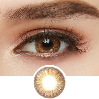 Tri-Color light brown color contact lens on top of a dark eye paired with light brown eyeshadow and curled wispy eyelashes, above the prescription contact lens pattern.