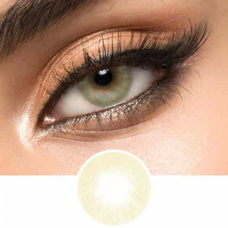 A hazel contact lens on top of a brown eye with smoky eye makeup and long eyelashes, above the design of the contact lens itself.