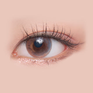 Macro shot of an eye wearing the i-Sha Season Eye Spring Pink prescription colour contact lens, showing the multi-colored detail and natural effect on dark brown eyes.