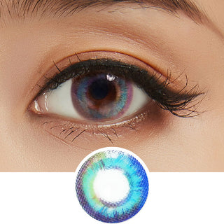 Macro shot of an eye wearing the Prism Blue cosmetic contact lens, showing the multi-colored detail and opacity effect on dark brown eyes.